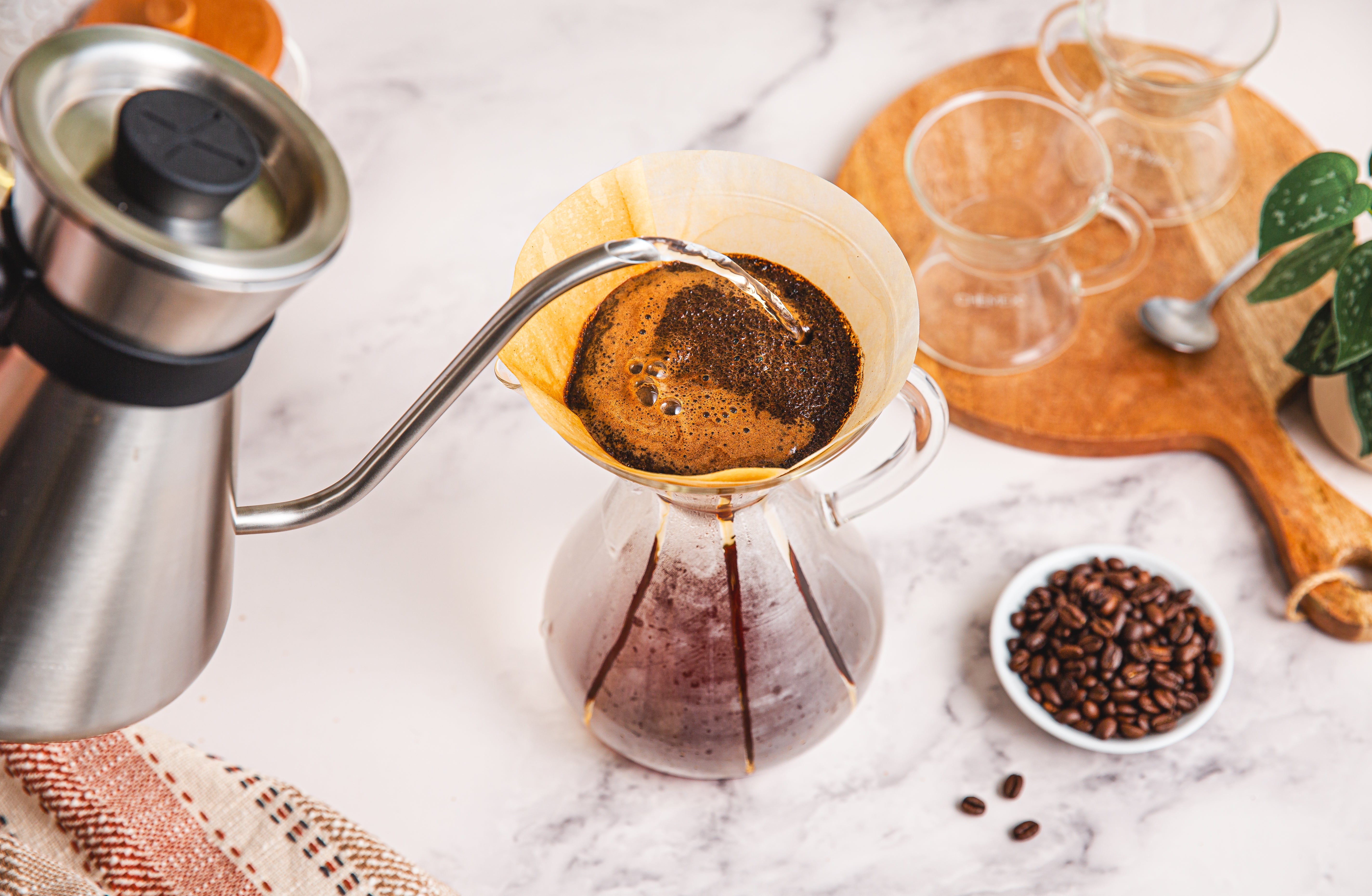 brewing coffee using a white circle filter, beautiful bloom apperaing