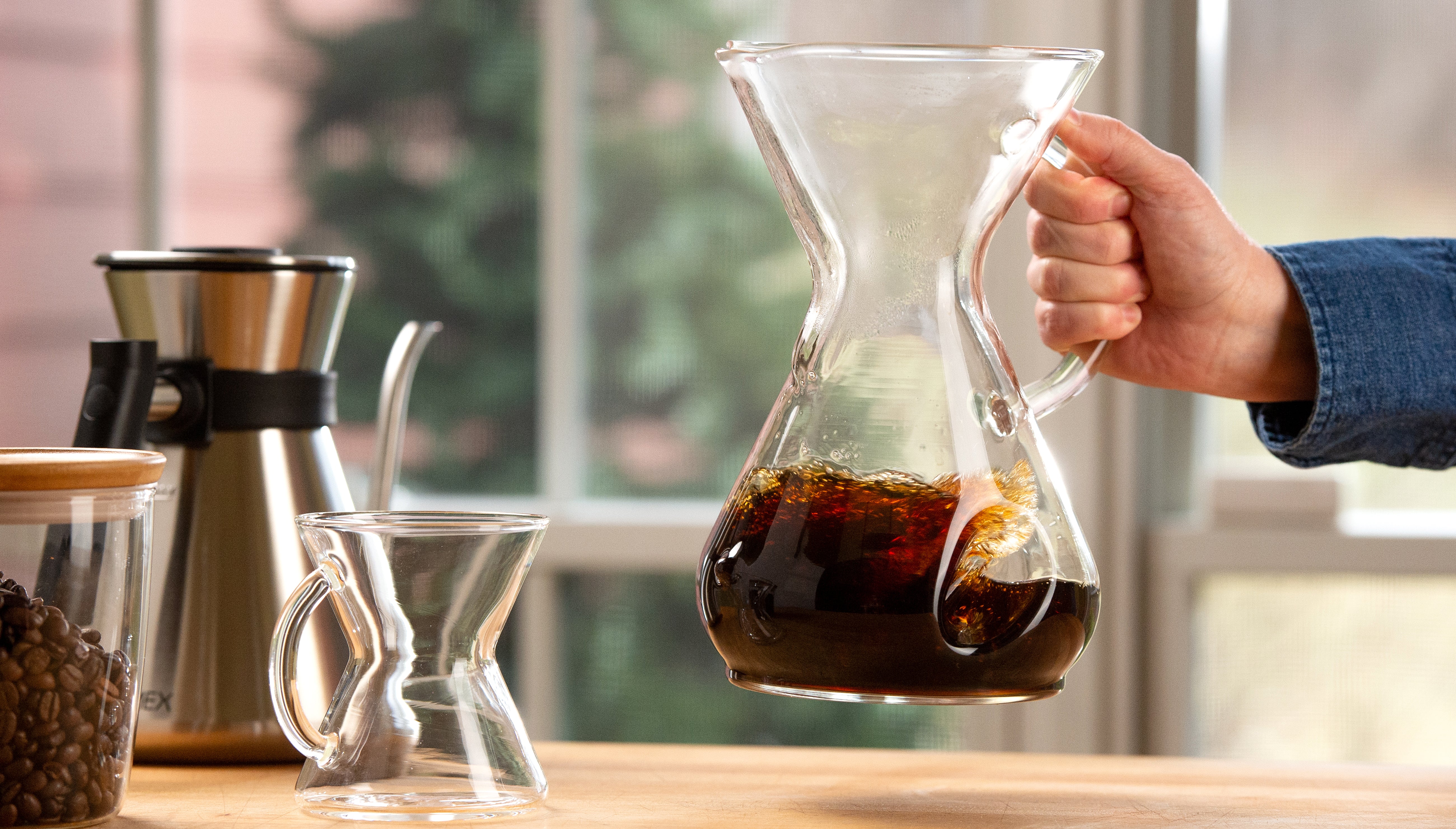 chemaer being swirled to aerate coffee