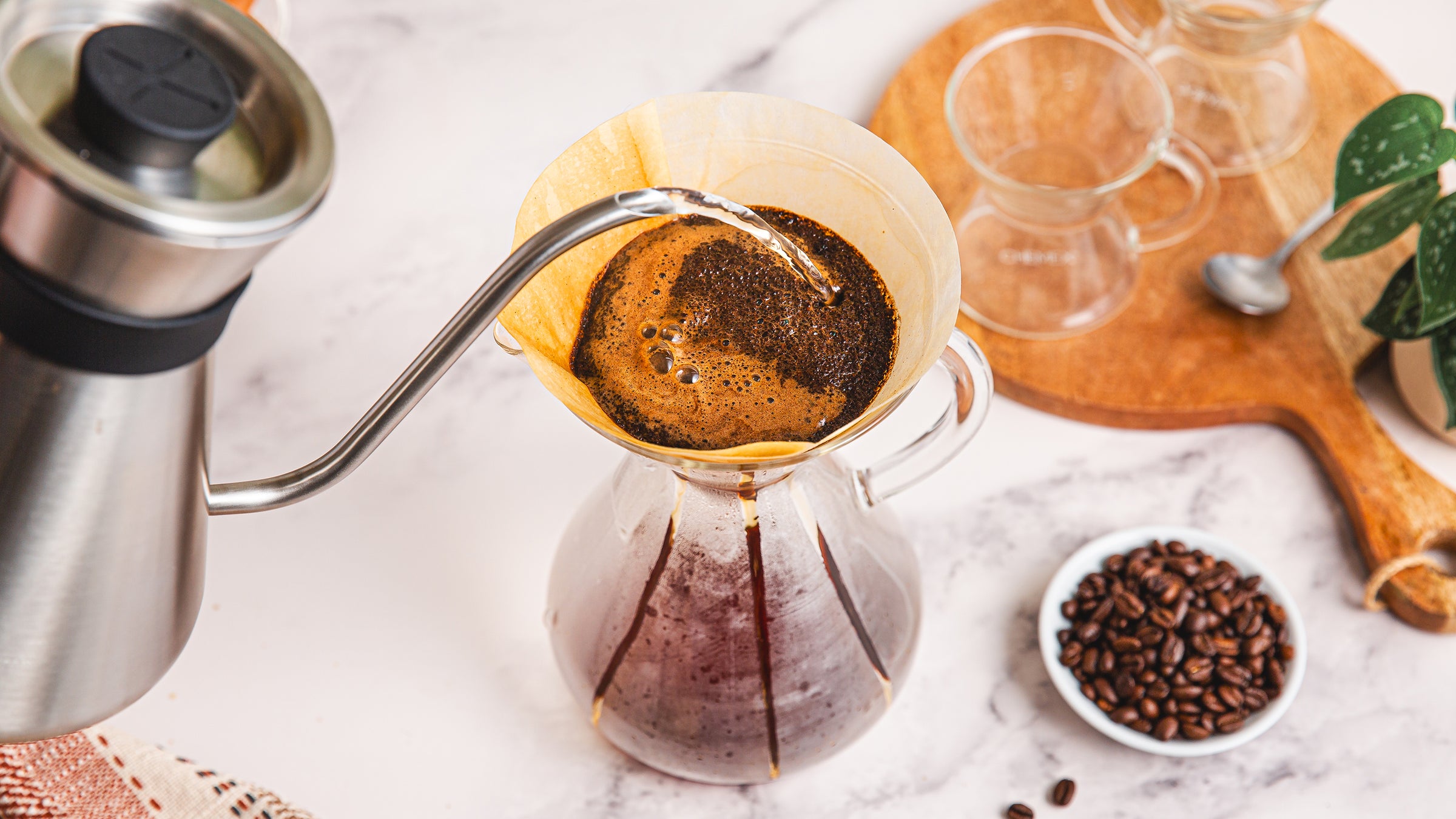 brewing coffee using a white circle filter, beautiful bloom appearing