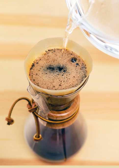 looking down at a 3-cup coffeemaker being brewed