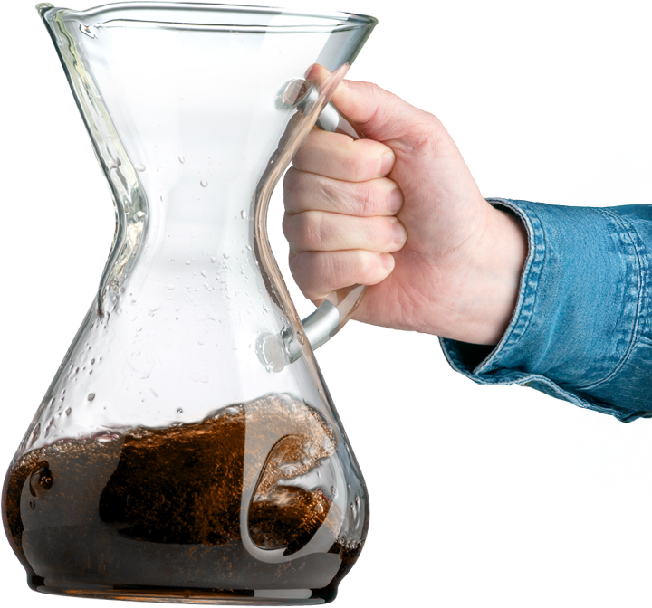 The CHEMEX ChemAer® — part brewer, part aerator, held mid-pour with brewed coffee inside, 2023